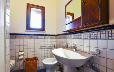 a bathroom with a sink and a toilet at Stunning Home In Trappeto With Wifi in Trappeto