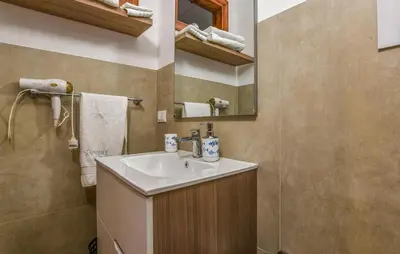 a bathroom with a sink and a mirror at Stunning Home In Trappeto With Wifi in Trappeto