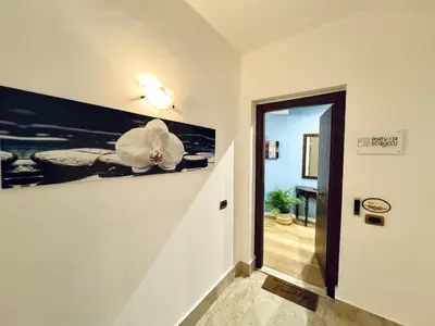 a hallway with a white flower on the wall at Ventu di Sciroccu in Cinisi