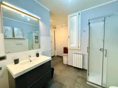 a bathroom with a sink and a glass shower at Ventu di Sciroccu in Cinisi
