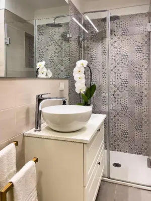 a bathroom with a sink and a shower at Flat44 in Palermo