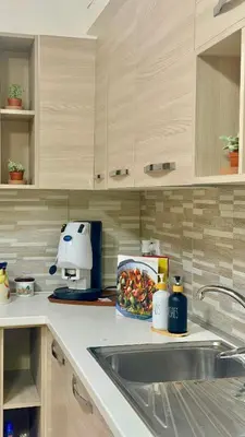 a kitchen counter with a sink and a mixer at Campofelice Happy Casa in Campofelice di Roccella