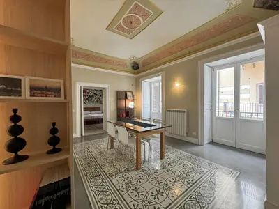 a home office with a desk in a room at La casa di Alice Palermo Casa Professa in Palermo