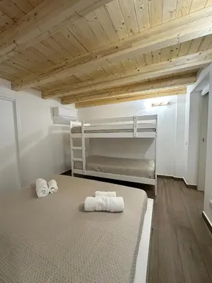 a bedroom with two bunk beds with towels on it at M&F Home in Palermo