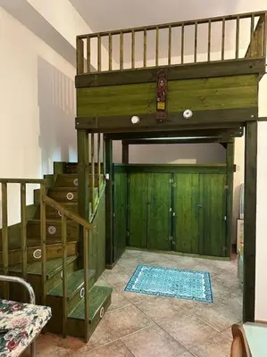 a bunk bed in a room with a door at Casa Vacanze Sole in Castellammare del Golfo