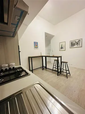 a kitchen with a stove and a counter top at Casa Politeama Florio - Palermo centro in Palermo