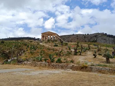 a building on top of a hill with trees at La Casetta di Nino in Castellammare del Golfo