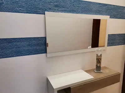 a bathroom with a sink and a mirror at La Vie Est Belle in Balestrate