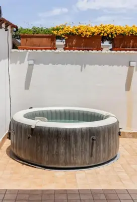 a large wooden tub sitting on top of a building at Il Canto di Euterpe in Palermo