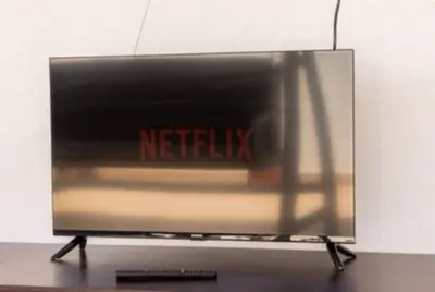 a television screen with the netflix sign on it at Il Canto di Euterpe in Palermo