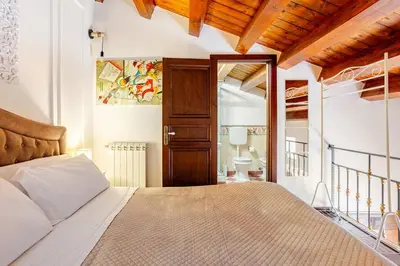 a bedroom with a bed in a room at Dimora degli Scalzi - Dive into Palermo's History in Palermo