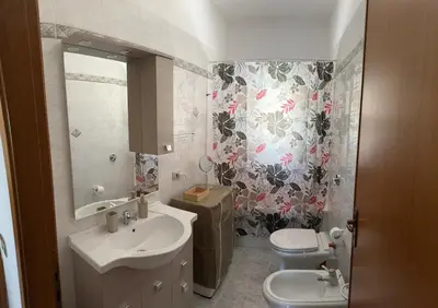 a bathroom with a sink and a toilet and a mirror at Villa Il Giardino di Rosa- 5 Min from the sea-Fraginesi in Castellammare del Golfo