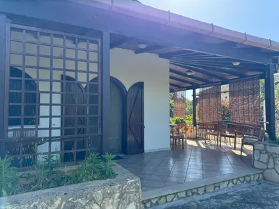 a pergola with tables and chairs on a patio at Villa Il Giardino di Rosa- 5 Min from the sea-Fraginesi in Castellammare del Golfo