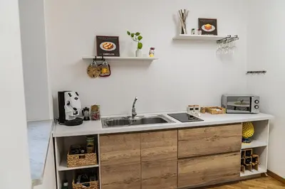 a kitchen with a sink and a counter at SANT'ELIGIO APARTMENTS & ROOMS in Palermo