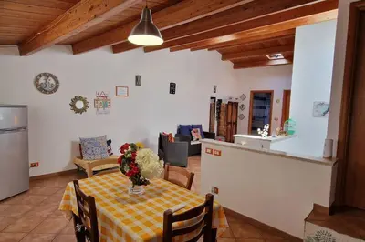 a living room with a table with a vase of flowers on it at home indipendenza 2 in Palermo