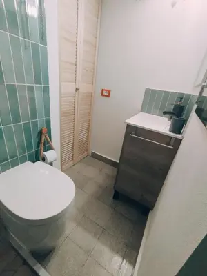 a bathroom with a toilet and a sink at Le due Marie in Palermo