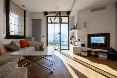 a living room with a couch and a table at Villa Maurino by DomuSicily in Mondello