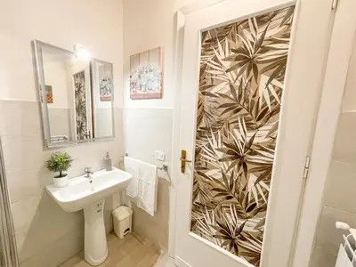 a bathroom with a sink and a mirror at Al Politeama Rooms B&B in Palermo