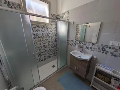 a bathroom with a shower and a sink at Mondello Villetta Giusi in Mondello
