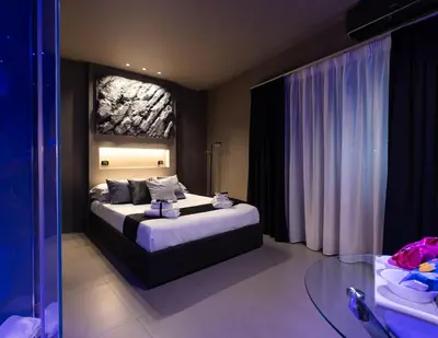 a bedroom with a large bed in a room at Platinum Suite&Spa in Palermo