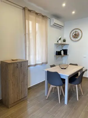 a bedroom with a bed with two towels on it at Casetta al Molo Trapezoidale in Palermo