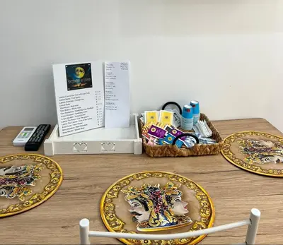 three plates on a wooden table with a basket of food at Incanto di luna Apartment in Palermo