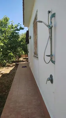a walkway leading to a building with a window at Balestrate holiday home 70 Mq in Balestrate