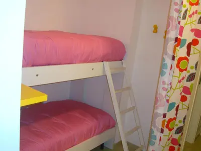 two bunk beds in a room with a ladder at Aurora e Andrea San Vito lo Capo in San Vito lo Capo