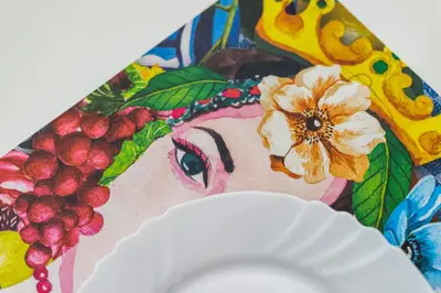 a painting of a woman with a flower on a plate at Quattro Canti rooms in Palermo