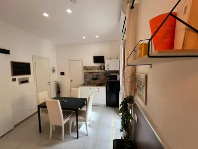 a kitchen and dining room with a table and chairs at Casa di DaFe-Casa Vacanze in Castellammare del Golfo
