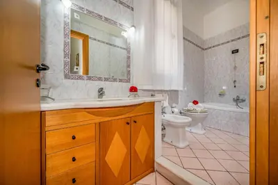 a bathroom with a sink and a tub and a toilet at Casa Dolce Casa in Castellammare del Golfo
