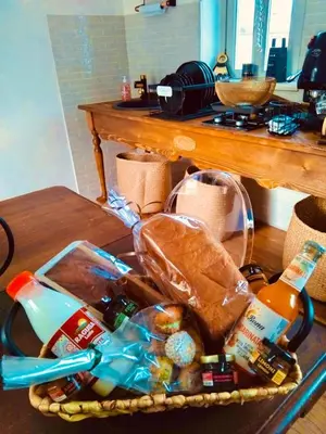 a basket of food and drinks on a table at Donna Carmela in Porticello