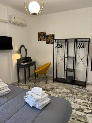 a room with a bed and a desk and a mirror at A CASA DI GRACE in Palermo