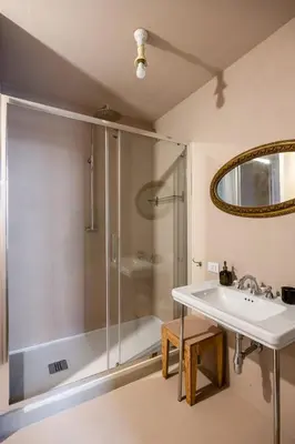 a bathroom with a shower and a sink at Palazzo Sant'Isidoro by DomuSicily in Palermo