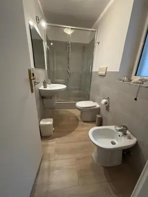 a bathroom with a sink and a toilet and a shower at Casa Amarilla in Palermo
