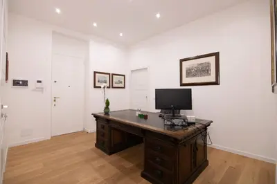 an office with a desk with a computer on it at Villareale47 Luxury Suites & Rooms in Palermo