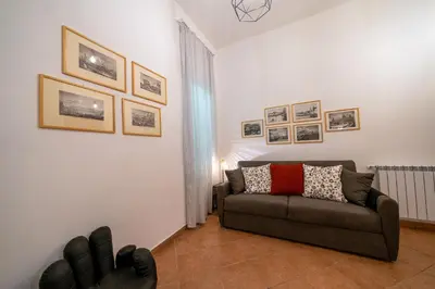 a flat screen tv sitting on top of a cabinet at Palermo e Dintorni - Valentino Apartment in Palermo