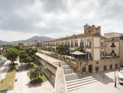 a large building with a staircase in front of it at BIBI rooms and suite in Palermo