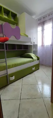 a bedroom with a bunk bed with a elephant on it at Appartamento Arancio in San Vito lo Capo