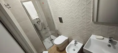 a bathroom with a shower and a toilet and a sink at Profumo di casa in Lascari