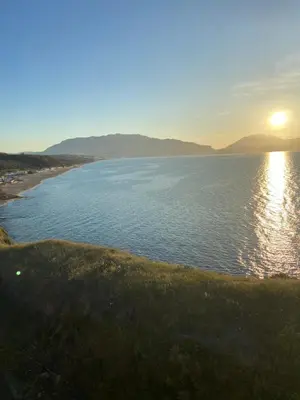 a view of a body of water with the sun setting at Villa Rosa Bella Vista Balestrate in Balestrate