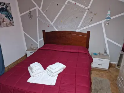 a bedroom with a bed with white towels on it at Le stanze di Aurora in Palermo