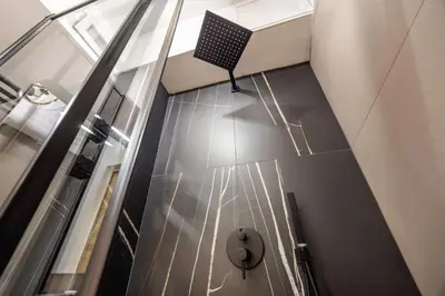 a hallway with a chair on the floor of a building at Al Borghetto marinaro in Palermo