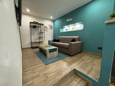 a living room with a couch and a table at Sogni d'oro in Partinico