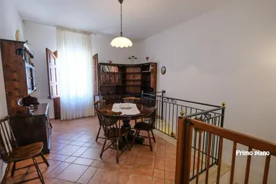 a dining room with a table and chairs at Appartamenti Esther in San Vito lo Capo