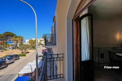 a balcony of a building with a view of a street at Appartamenti Esther in San Vito lo Capo