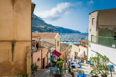 a view from a balcony of a town with boats at Le Scalette in Castellammare del Golfo