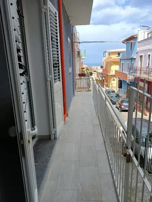 a balcony of a building with a walkway at Il Tramonto - BALESTRATE in Balestrate