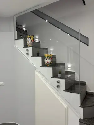 a stair case with some vases on it at Vespro House in Palermo