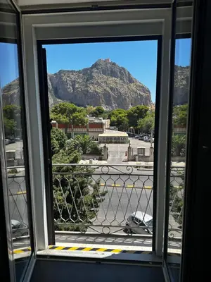 a view of a mountain from a window at Il falchetto in Palermo
